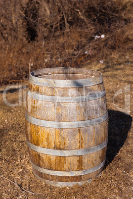 Worn wooden barrel casting shadow