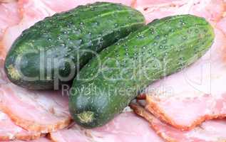 two cucumber on ham meat