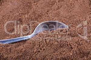milled coffee  and teaspoon