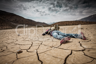Person lays on the dried ground