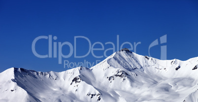 Panoramic view on off-piste snowy slope