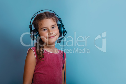 Girl  European appearance decade listening to music with headpho