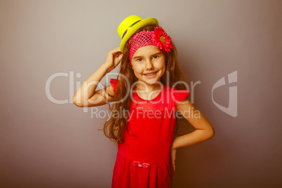 Girl European appearance haired child of seven years in a bright
