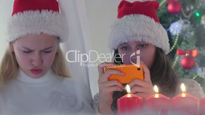 Children at home using new smart phone gifted for Christmas