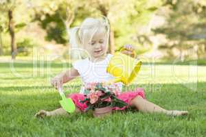 Little Girl Playing Gardener with Her Tools and Flower Pot
