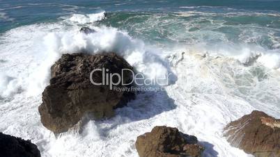 Slow Motion Ocean Waves Breaking on Rocks, storm weather