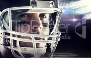 Composite image of american football player looking at camera