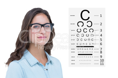 Composite image of pretty geeky hipster looking at camera