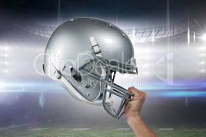 Composite image of close-up of american football player handing