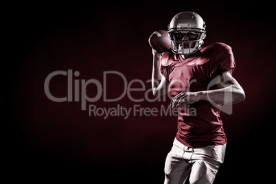 Composite image of portrait of sportsman throwing american footb Composite image of portrait of sportsman throwing american footb