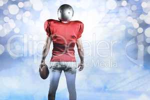 Composite image of rear view of american football player with ba