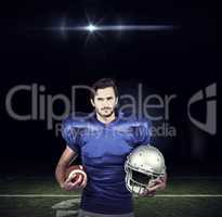 Composite image of confident american football player holding an