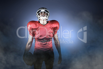 Composite image of american football player holding ball while l