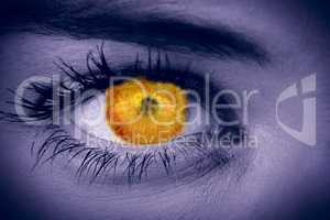 Composite image of orange eye on female face