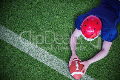 Composite image of american football player scoring a touchdown