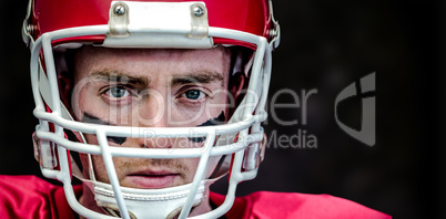 Composite image of portrait of focused american football player