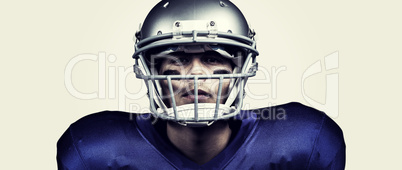 Composite image of portrait of determined american football play