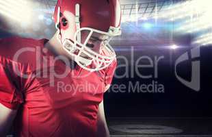 Composite image of american football player taking his helmet on
