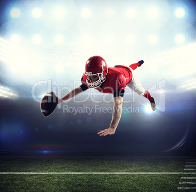 Composite image of american football player reaching football