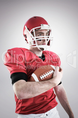 Composite image of american football player being ready for play