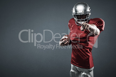 Composite image of portrait american football player in red jersey pointing