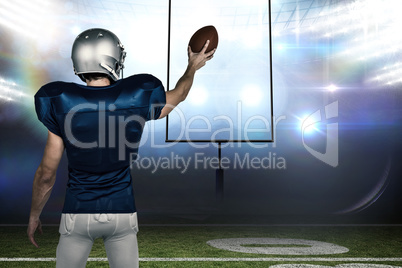 Composite image of rear view of sports player holding ball