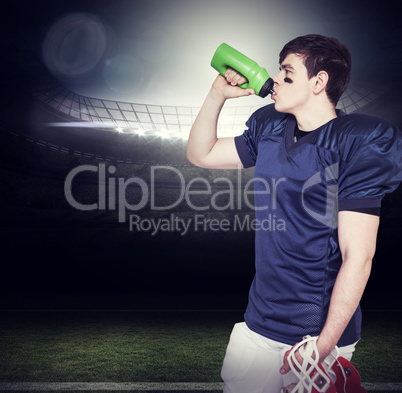 Composite image of american football player drinking water
