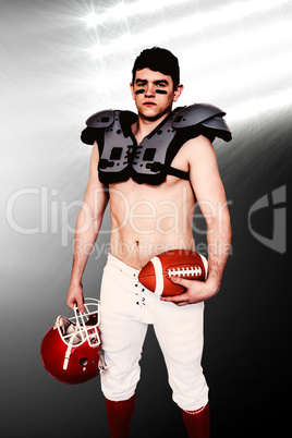 Composite image of american football player holding a ball and h