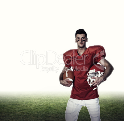 Composite image of portrait of player holding rugby ball and hel