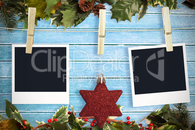 Composite image of hanging christmas photos