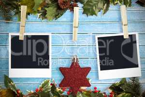 Composite image of hanging christmas photos