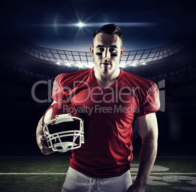 Composite image of american football player looking at camera