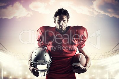 Composite image of confident american football player in red jer