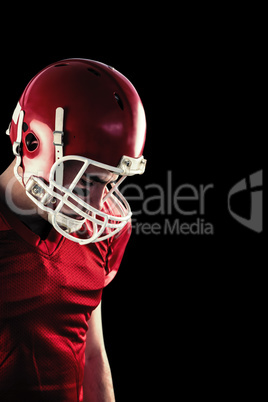 Composite image of amercian football player having his helmet on