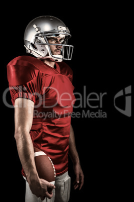 Composite image of serious american football player in red jerse