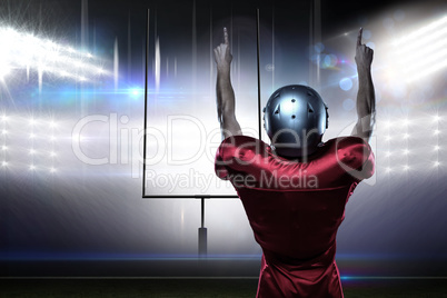 Composite image of rear view of american football player with ar