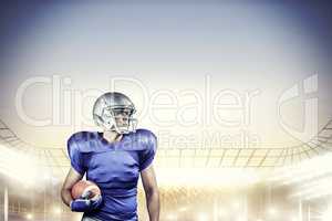 Composite image of confident american football player looking aw