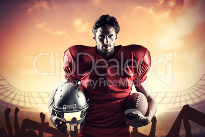 Composite image of confident american football player in red jer