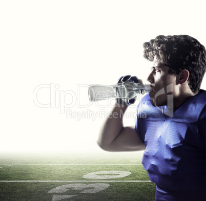 Composite image of side view of sportsman drinking water