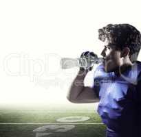 Composite image of side view of sportsman drinking water