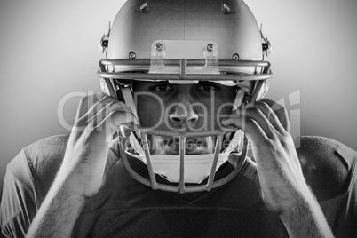 Close-up portrait of American football player holding helmet Close-up portrait of American football player holding helmet