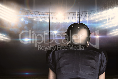 Composite image of rear view of american football player