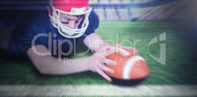 Composite image of american football player scoring a touchdown