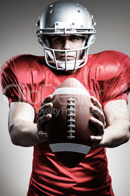 Composite image of portrait of determined american football play