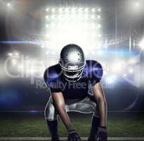 Composite image of american football player holding ball while c
