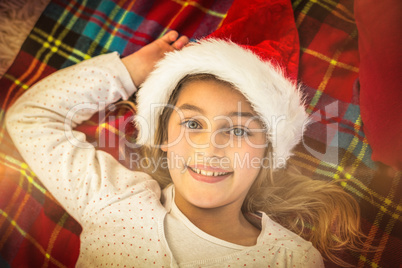 Festive little girl smiling on blanket