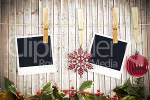 Composite image of hanging christmas photos