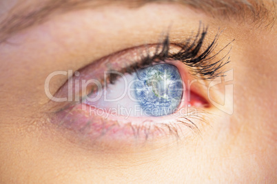 Composite image of close up of female blue eye