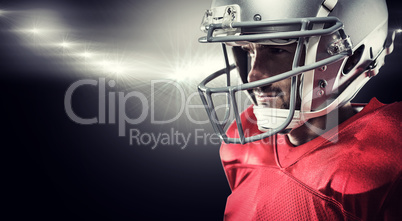 Composite image of american football player in red jersey lookin