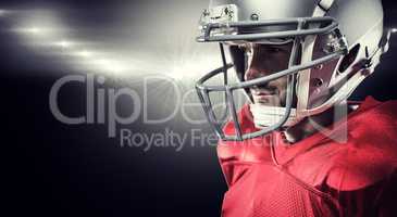 Composite image of american football player in red jersey lookin